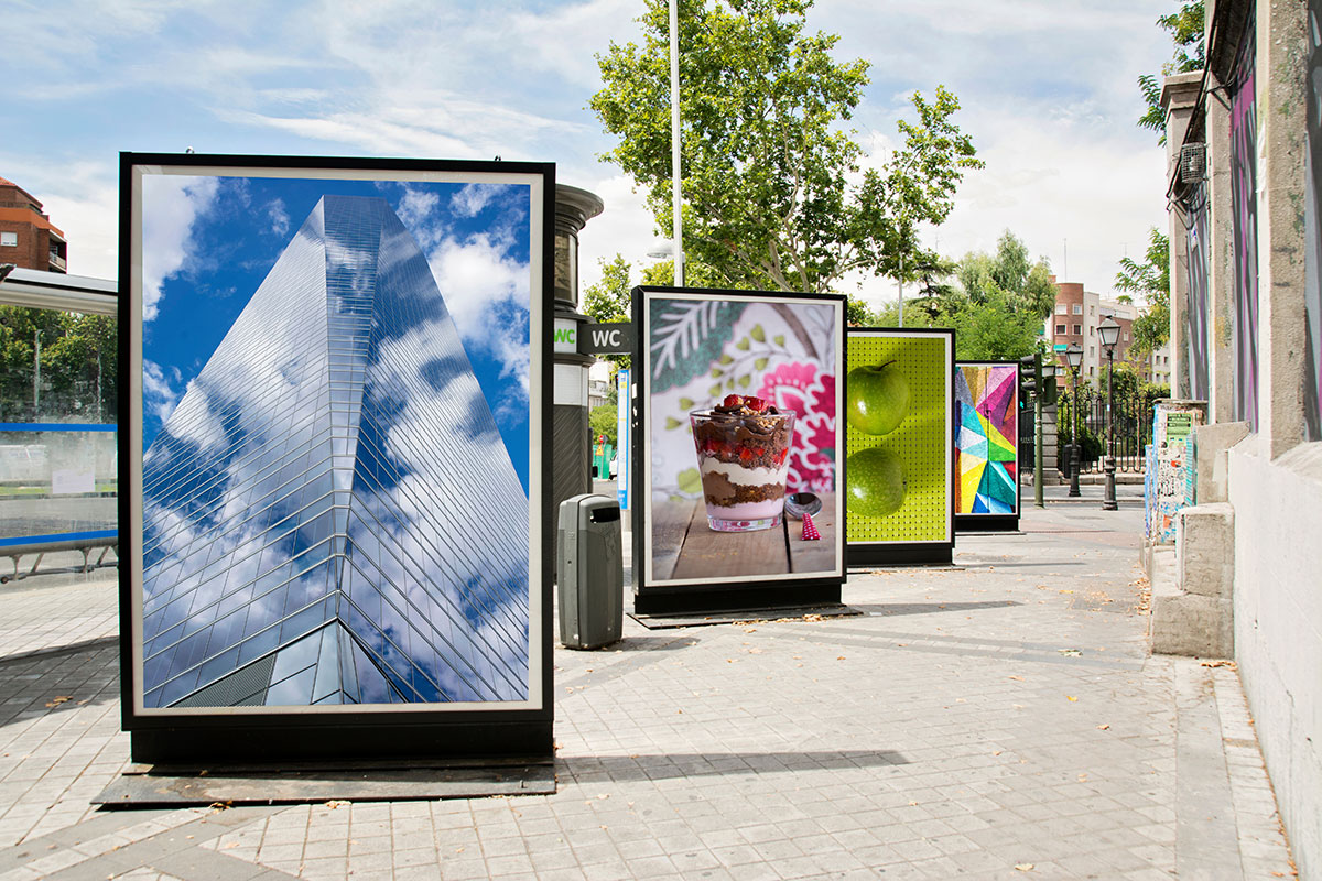 advertisement posters on signs along street